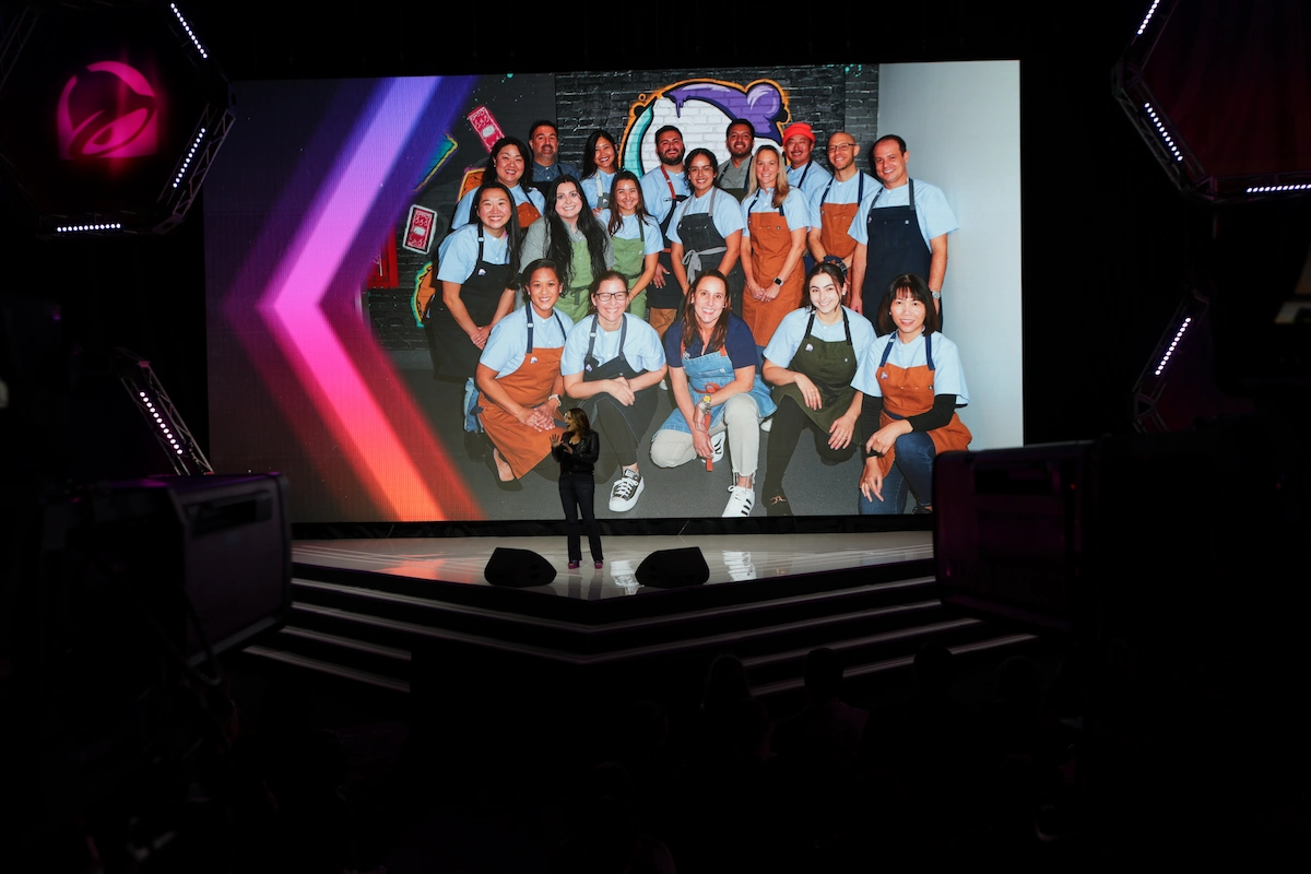 Taco Bell Live group photo on screen