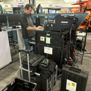 Hexagon Mining MINExpo crew member with equipment