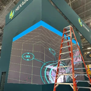 Hexagon Mining MINExpo vertical display with ladder